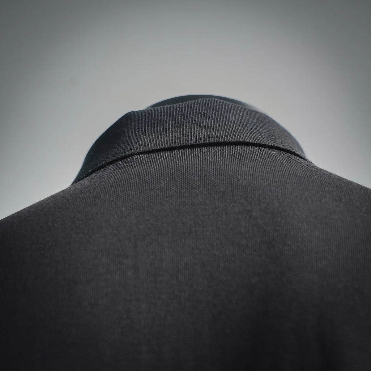 Dark polo shirt back collar with ribbed neckline trim