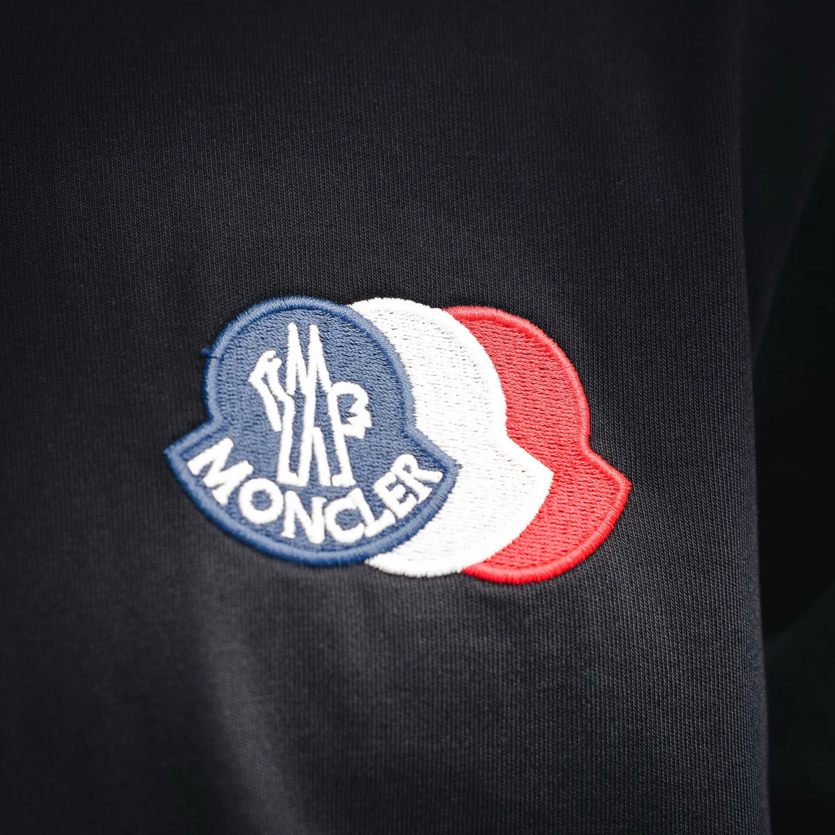 Moncler logo patch on dark short-sleeve T-shirt chest