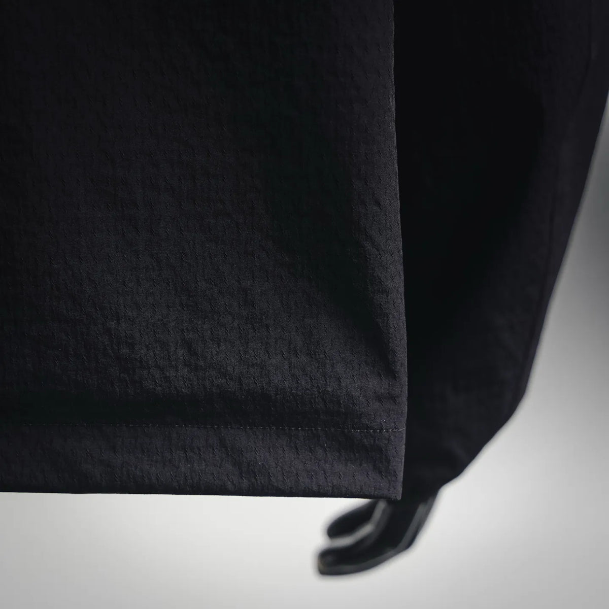 Moncler coat hem and elastic cuff detail in dark gray