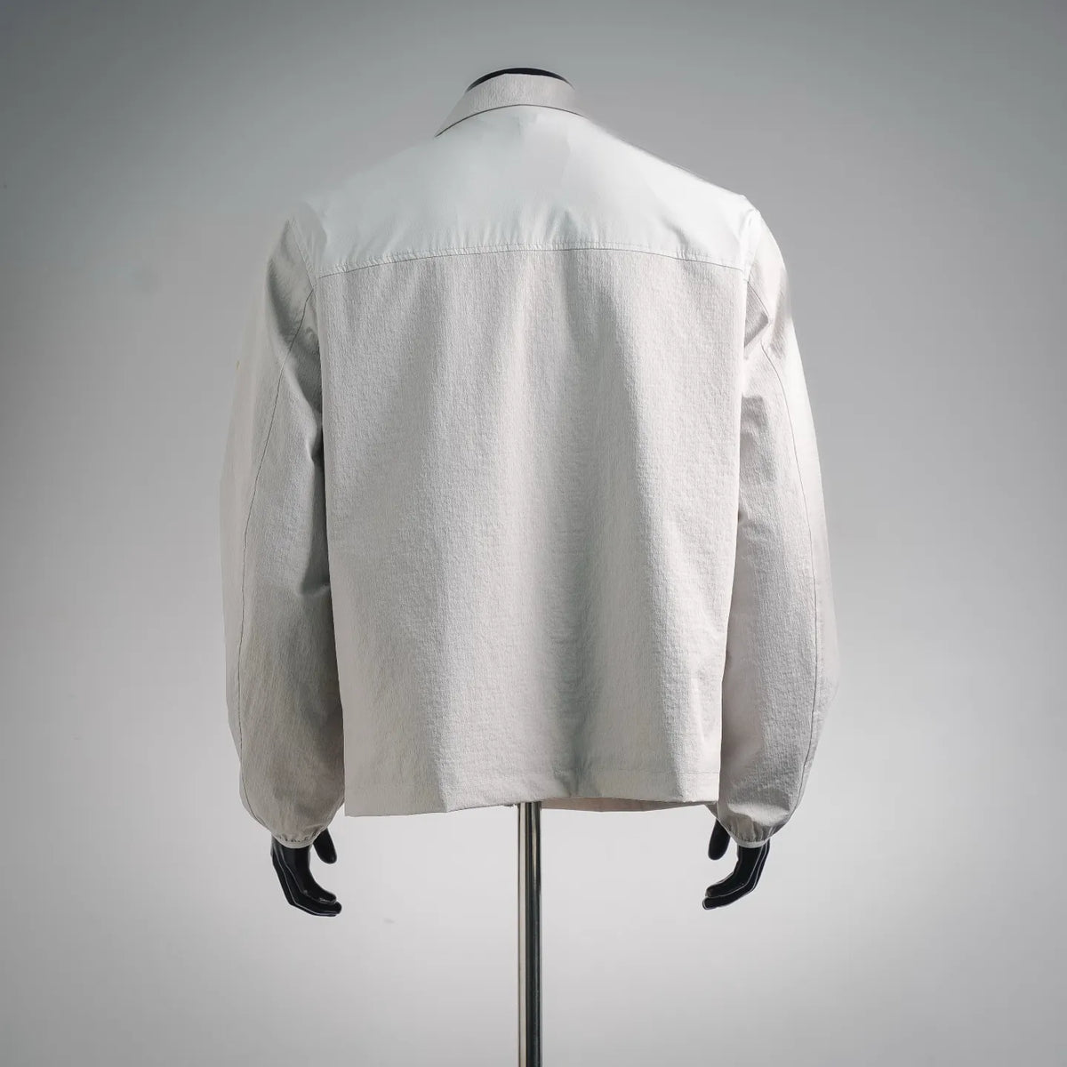 White Moncler coat with back view and stand collar
