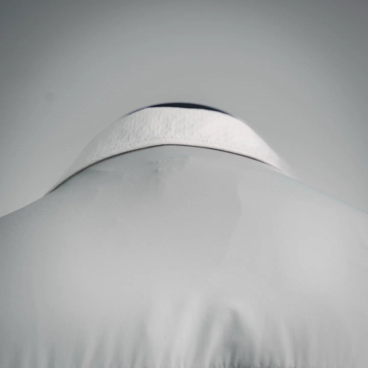 White Moncler coat hood detail with curved seam and top panel