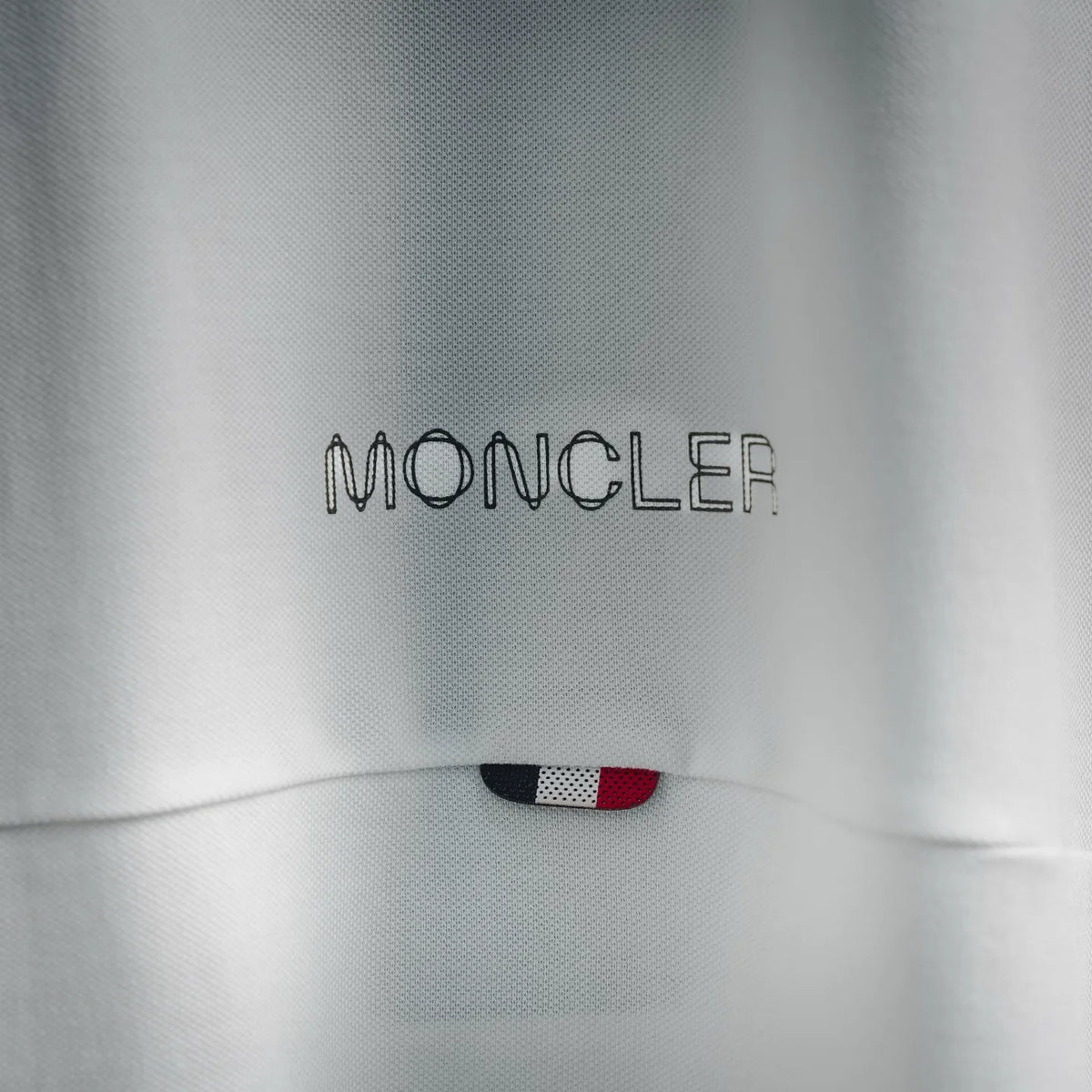 White polo shirt back yoke with Moncler embroidery and small trim detail