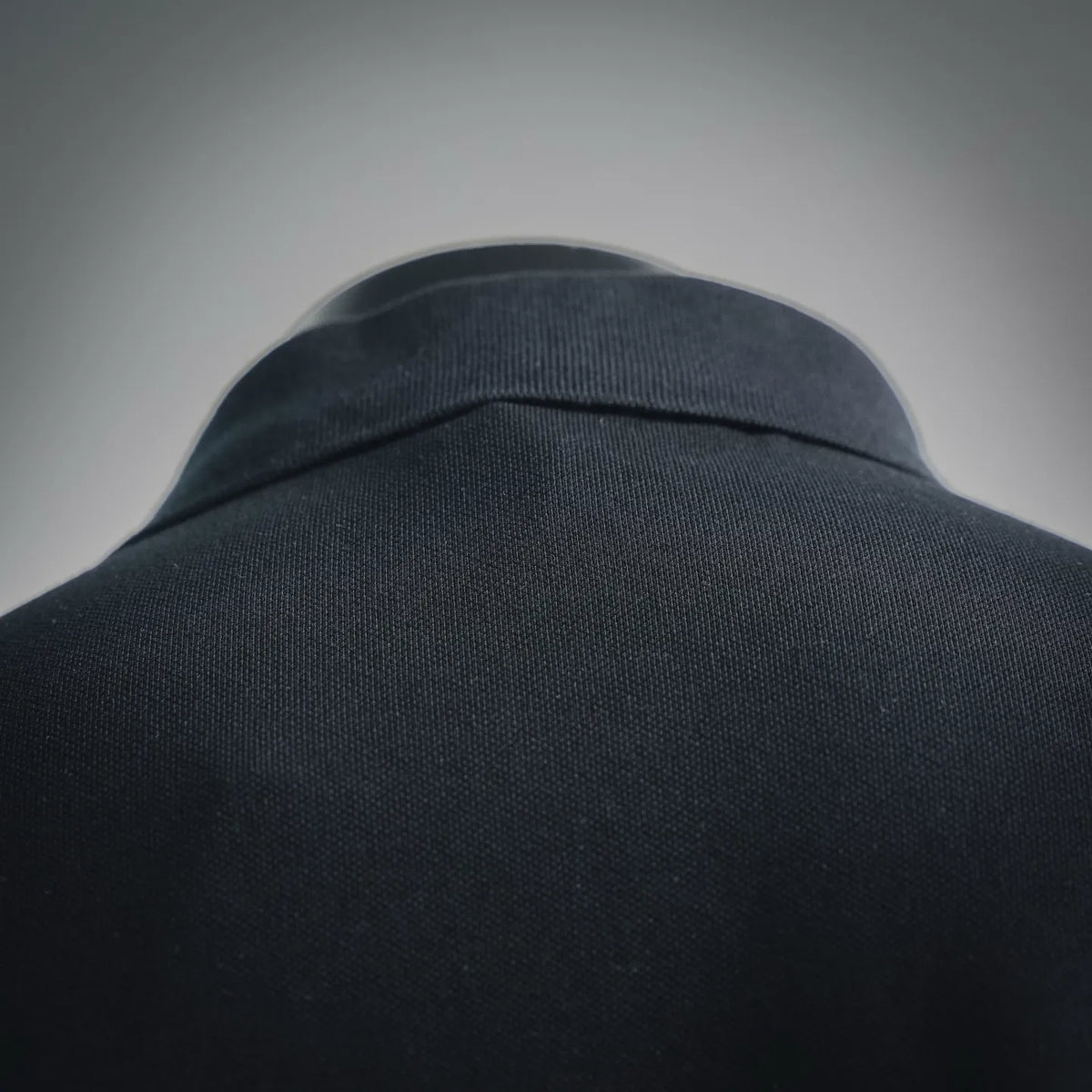 Dark black polo shirt collar and neckline, ribbed trim and button placket