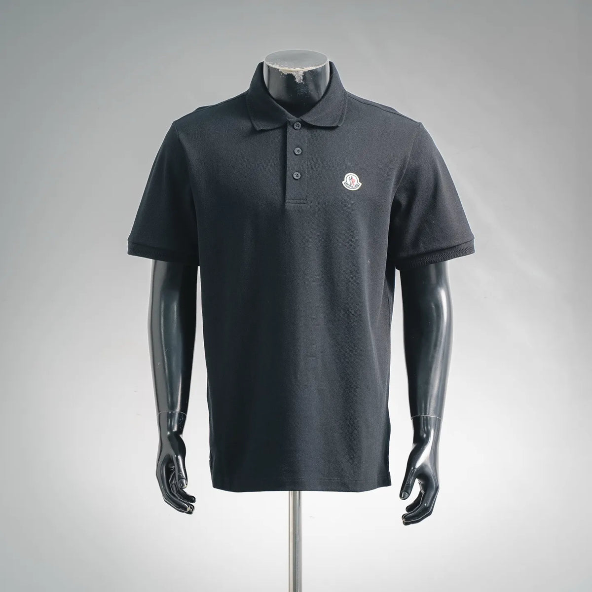 Moncler short-sleeve polo shirt, dark navy/black with button placket and crest logo