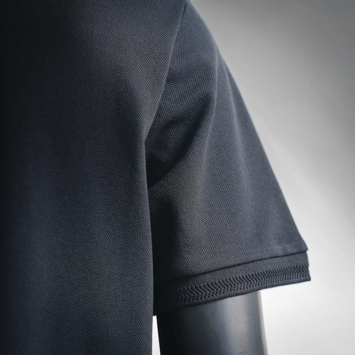 Moncler polo shirt sleeve with ribbed cuff edge in dark fabric