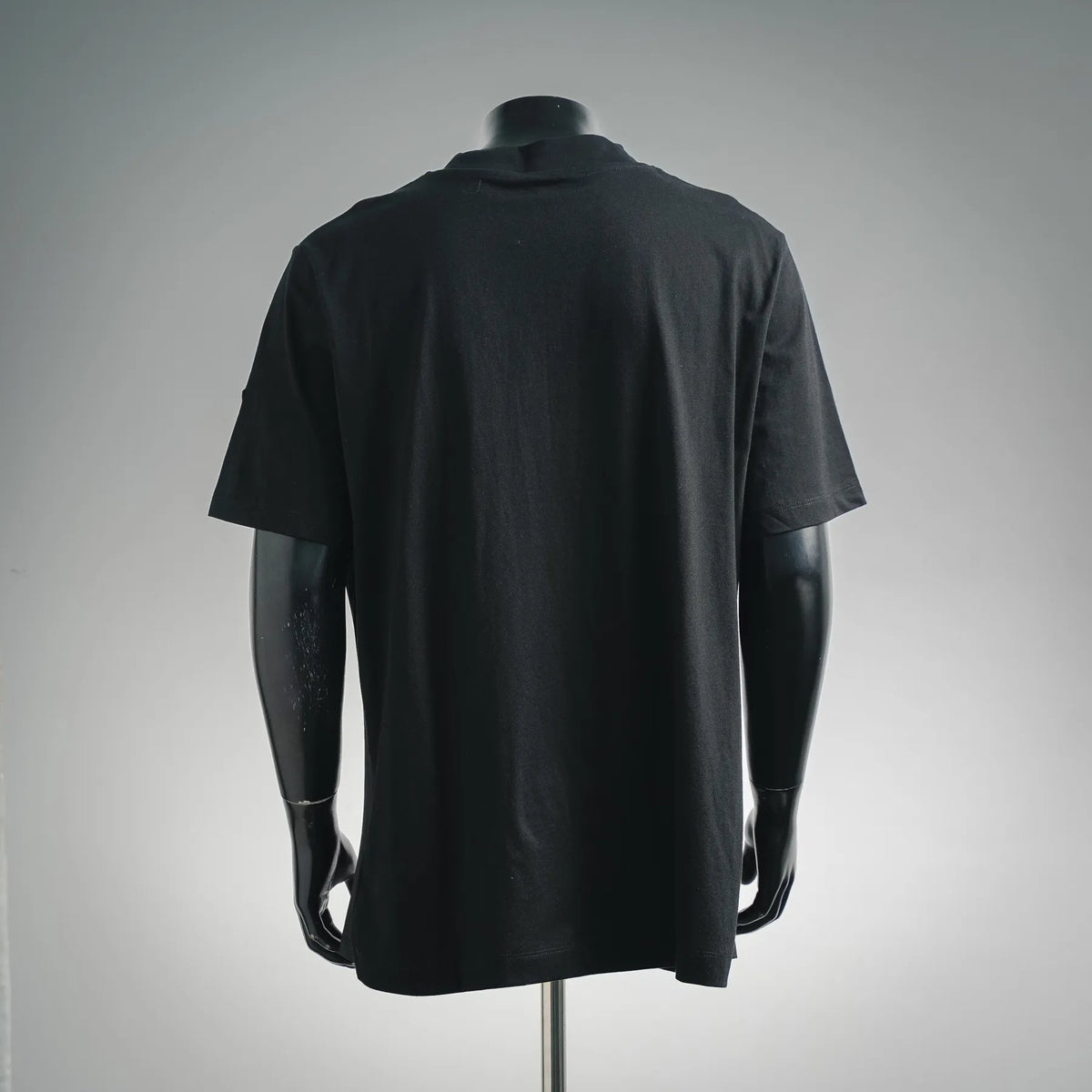 Moncler short-sleeve mock-neck T-shirt, back view in dark color