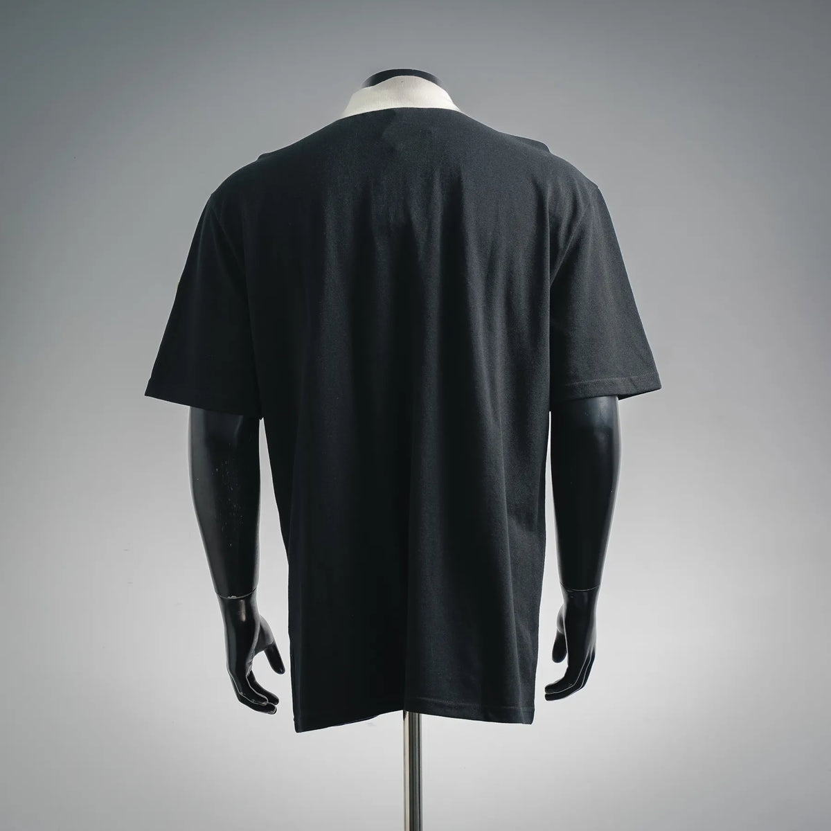 Black Moncler polo shirt back view with short sleeves and straight hem