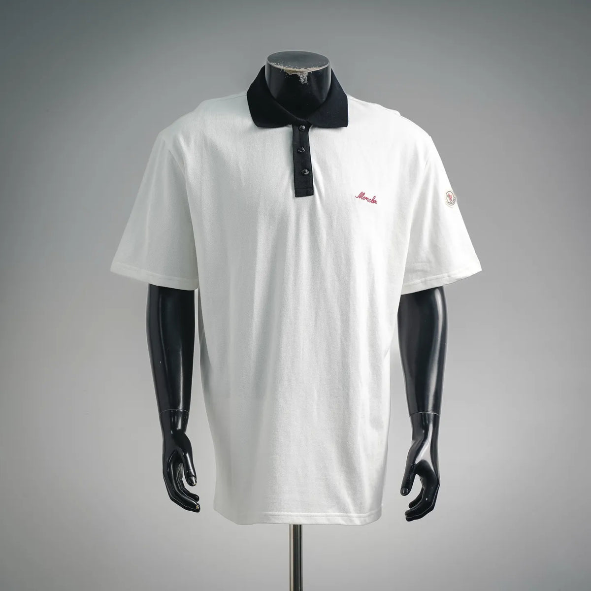 White Moncler polo shirt with black collar and button placket