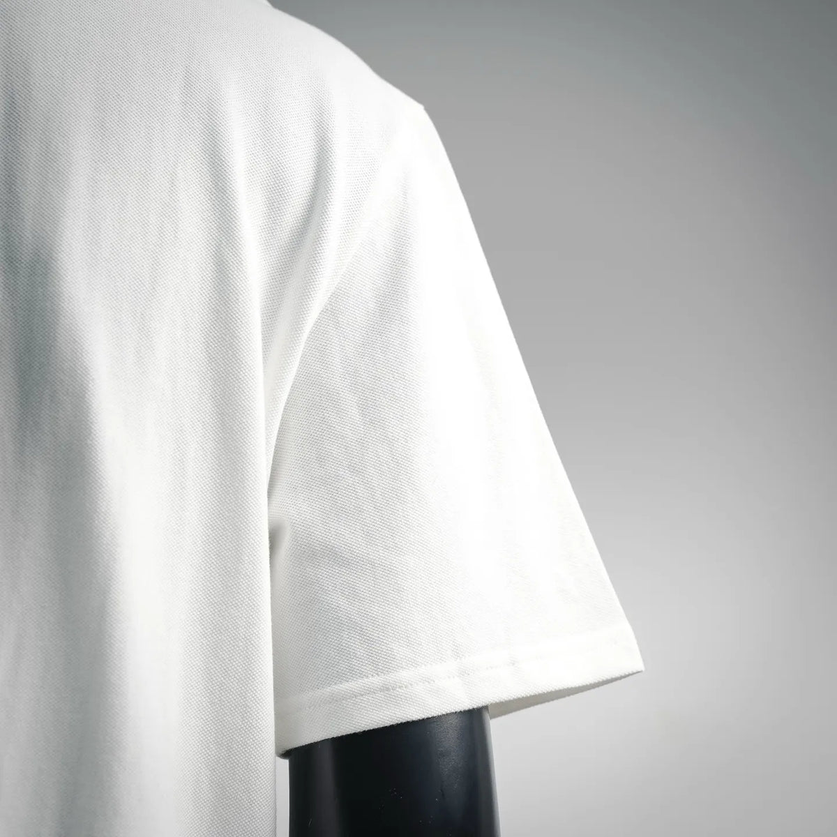 White polo shirt short sleeve with neat hem finish