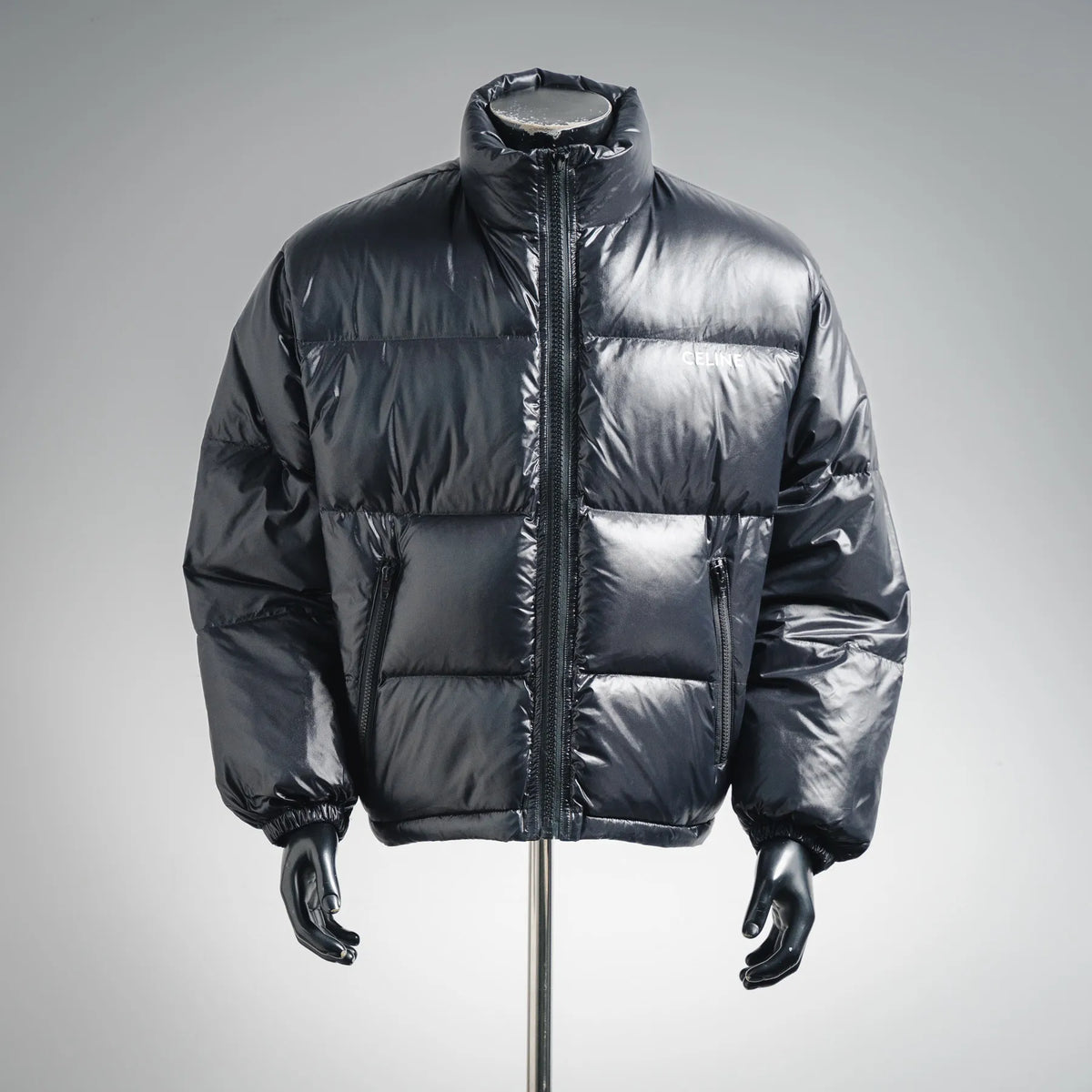 Moncler dark puffer coat with full-zip front and two side pockets