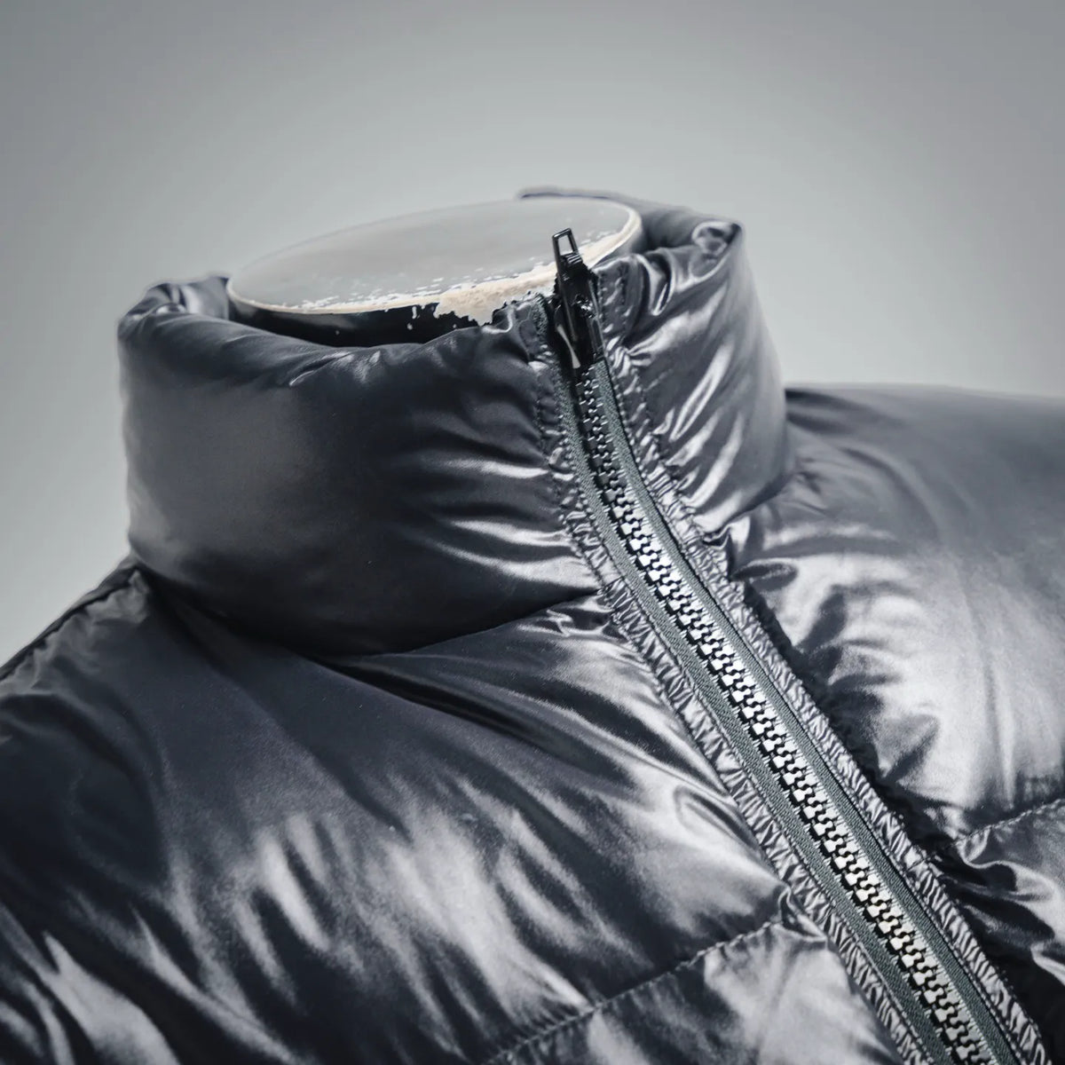 Moncler dark puffer coat with stand collar and metal front zipper