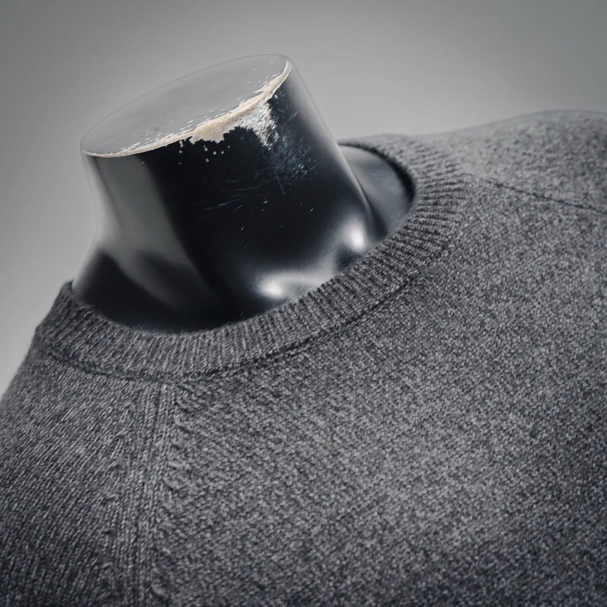 Gray heather crew-neck knit sweater with front button placket detail