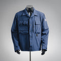 Blue long-sleeve jacket with button front and flap chest pockets