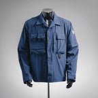 Blue long-sleeve jacket with button front and flap chest pockets