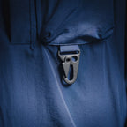 Blue jacket front with hook-and-loop strap and flap pocket