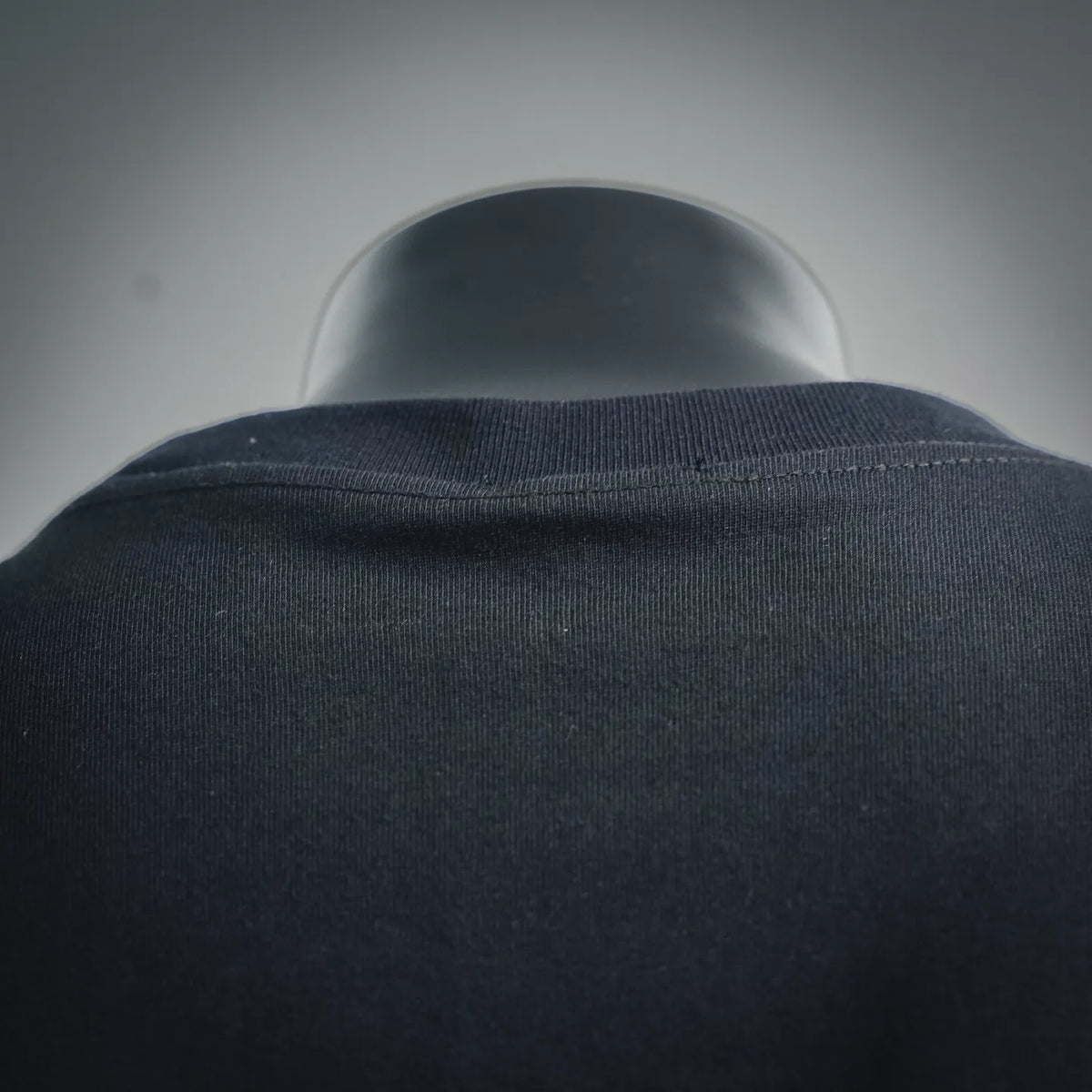 Men's Moncler black crew-neck T-shirt with ribbed collar close-up