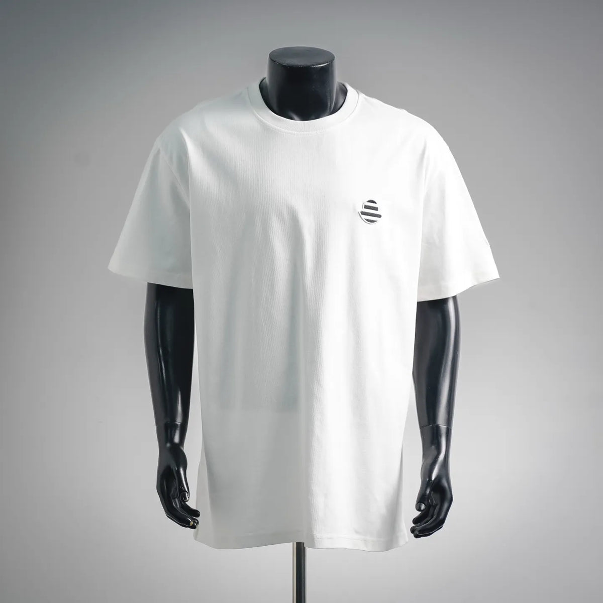 White short-sleeve T-shirt with small circular chest logo