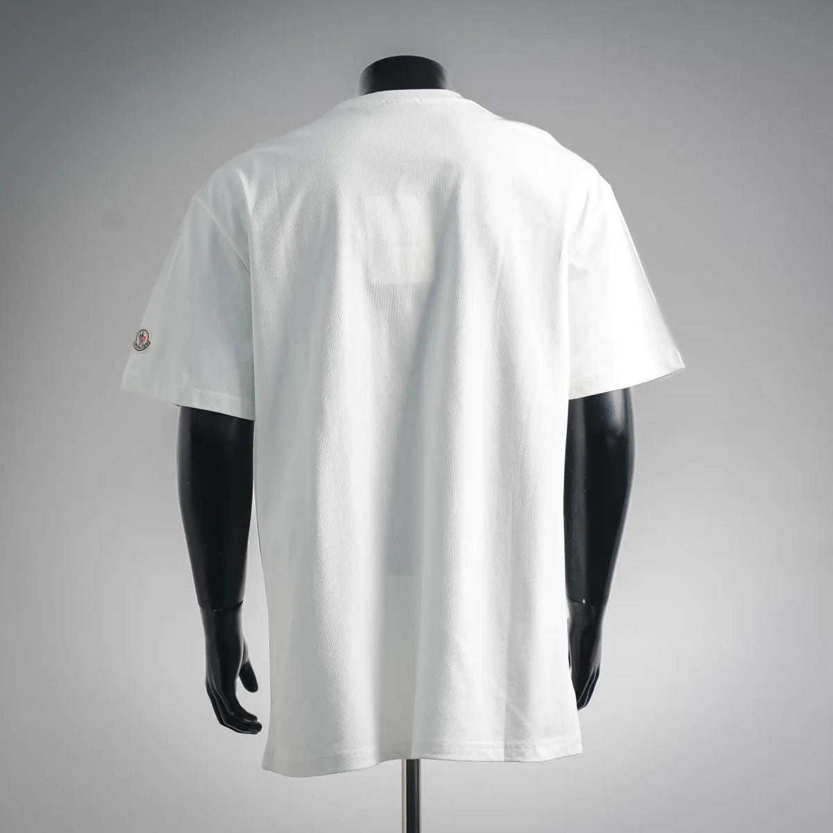 White short-sleeve T-shirt with small logo on left back