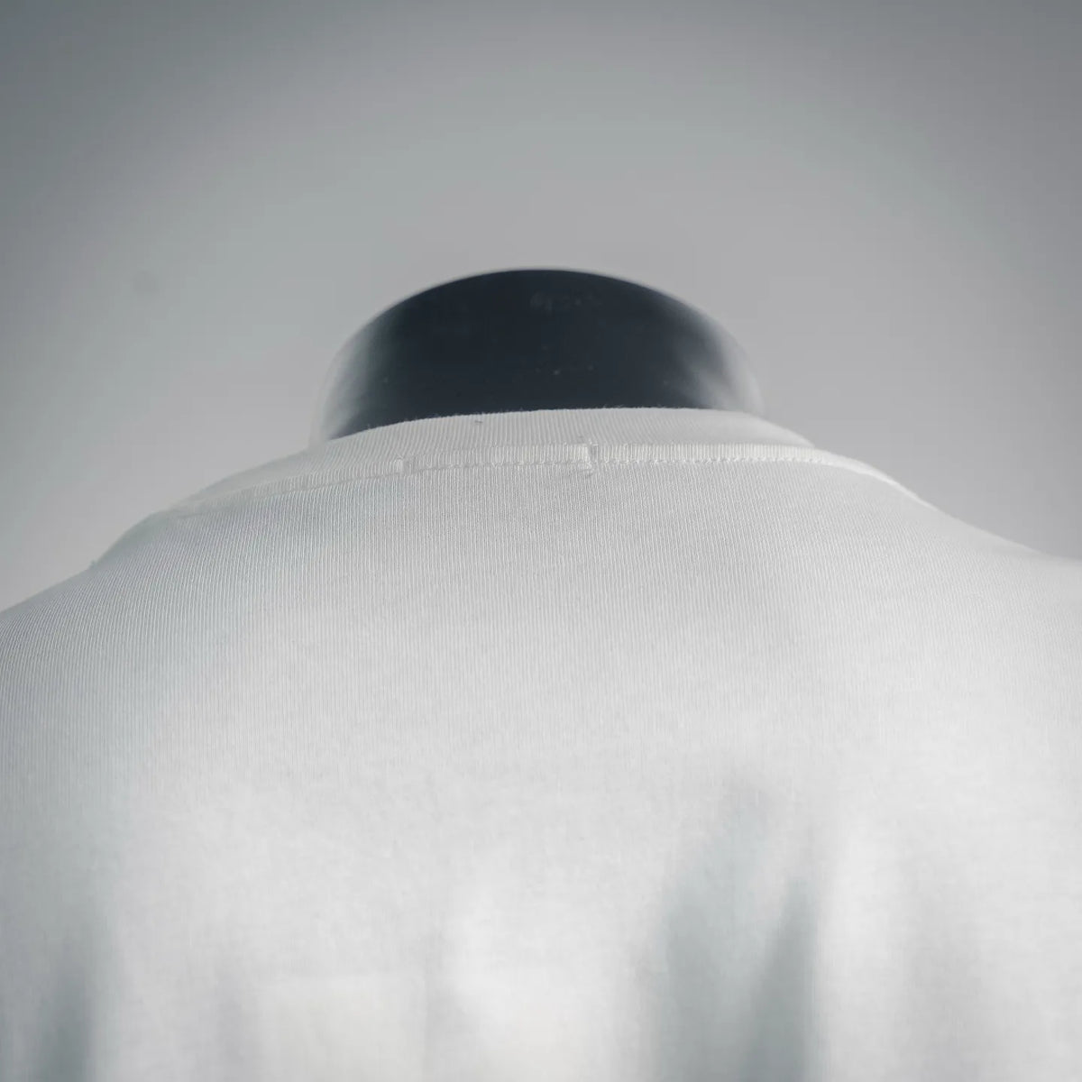 White T-shirt back neckline and shoulder seam detail