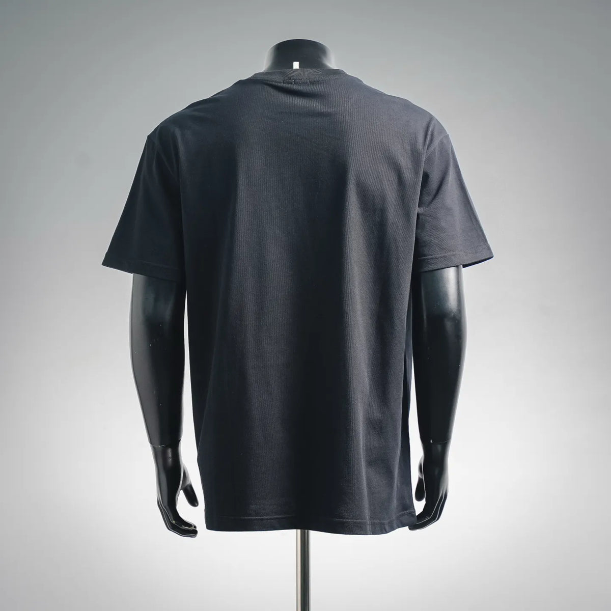 Dark navy Moncler Grenoble short-sleeve T-shirt with plain back on mannequin