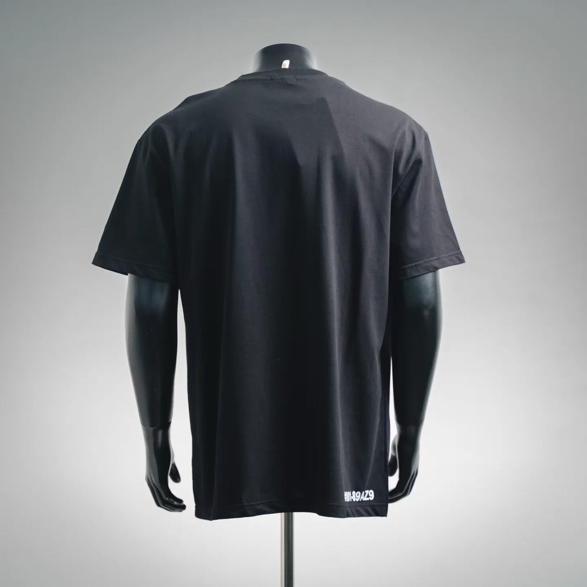 Black short-sleeve crewneck T-shirt with #001-89AZ9 print on the back hem
