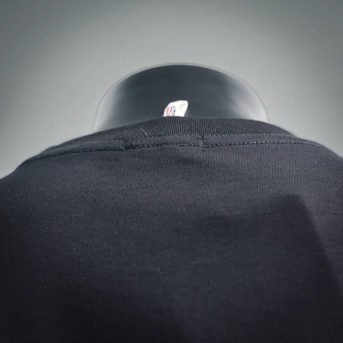 Black T-shirt crewneck collar seam detail