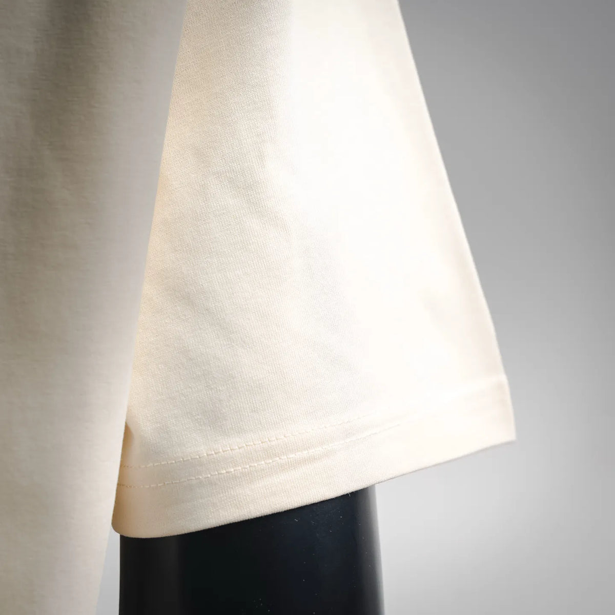 Moncler T-shirt side hem in light cream with neat stitched cuff edge