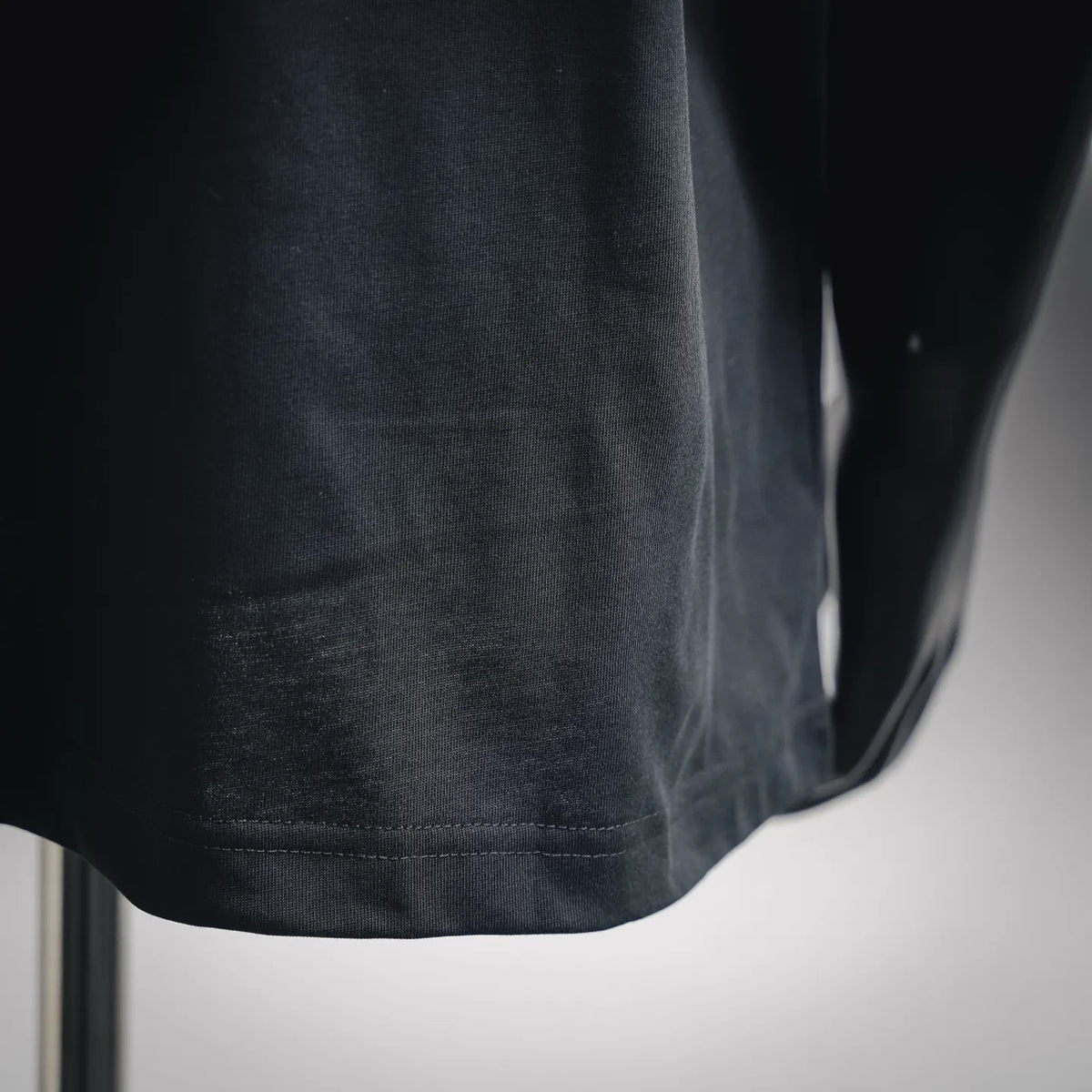 Black Moncler T-shirt with stitched lower hem detail