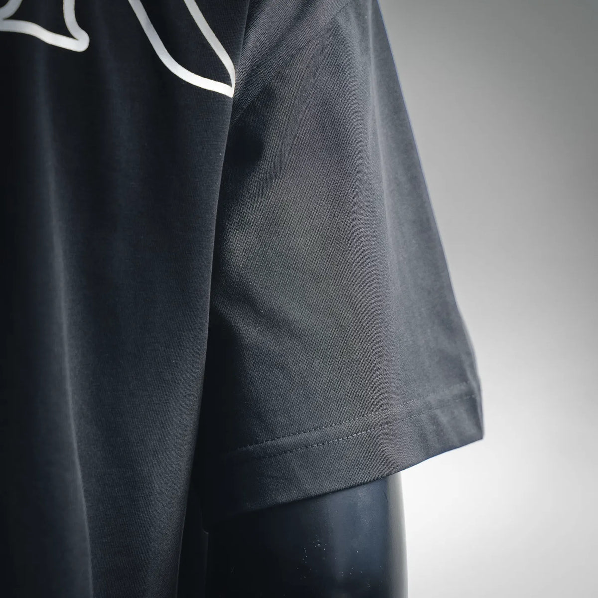 Black Moncler T-shirt side with short sleeve cuff and stitched hem