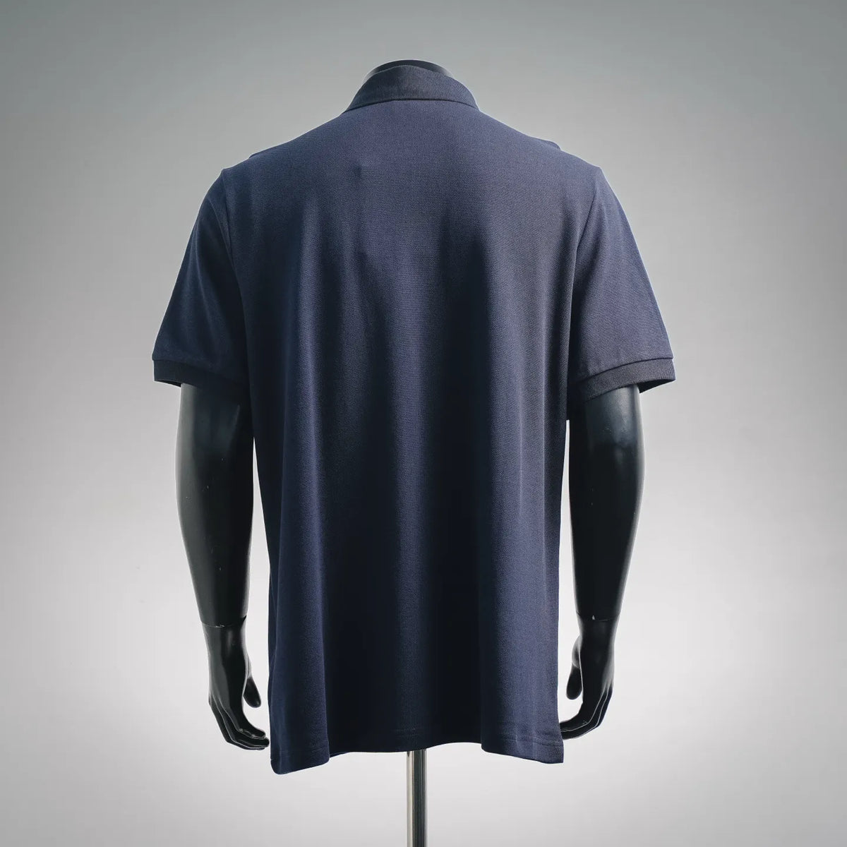 Moncler short-sleeve polo shirt back view, navy blue textured knit