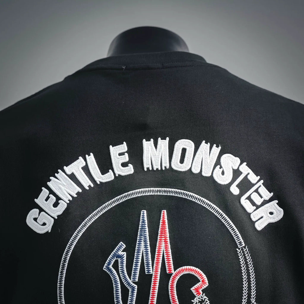Moncler black T-shirt back close-up with “Gentle Moncler” arched lettering