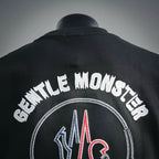 Moncler black T-shirt back close-up with “Gentle Moncler” arched lettering