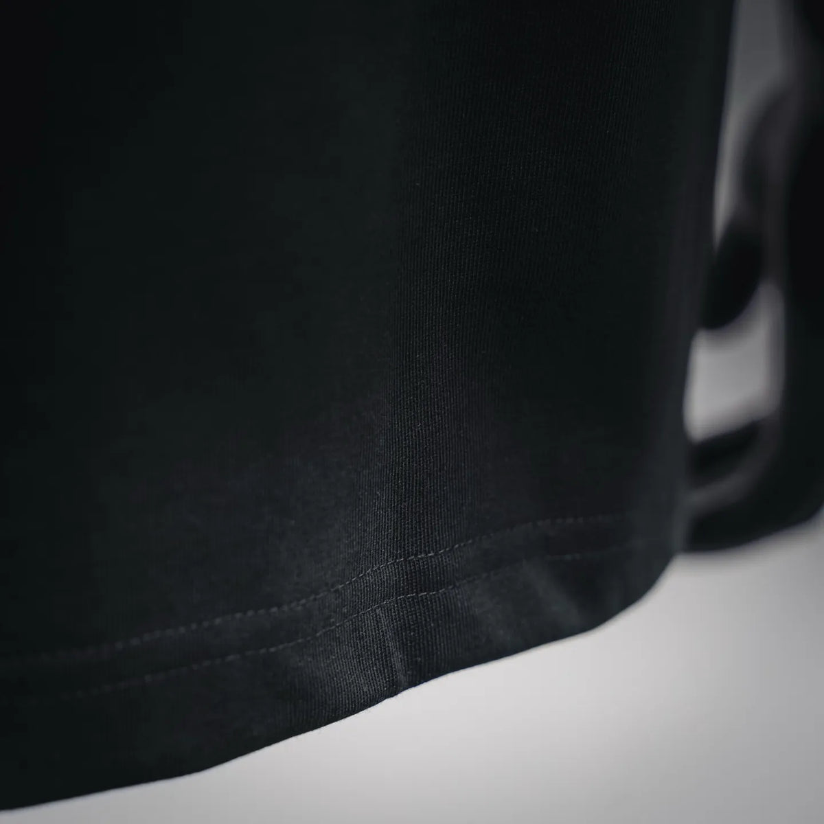 Moncler black T-shirt hem and stitching detail