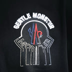Moncler black T-shirt back close-up of crest graphic with arched lettering