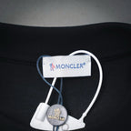 Moncler black T-shirt neck label and small hanging brand tag detail