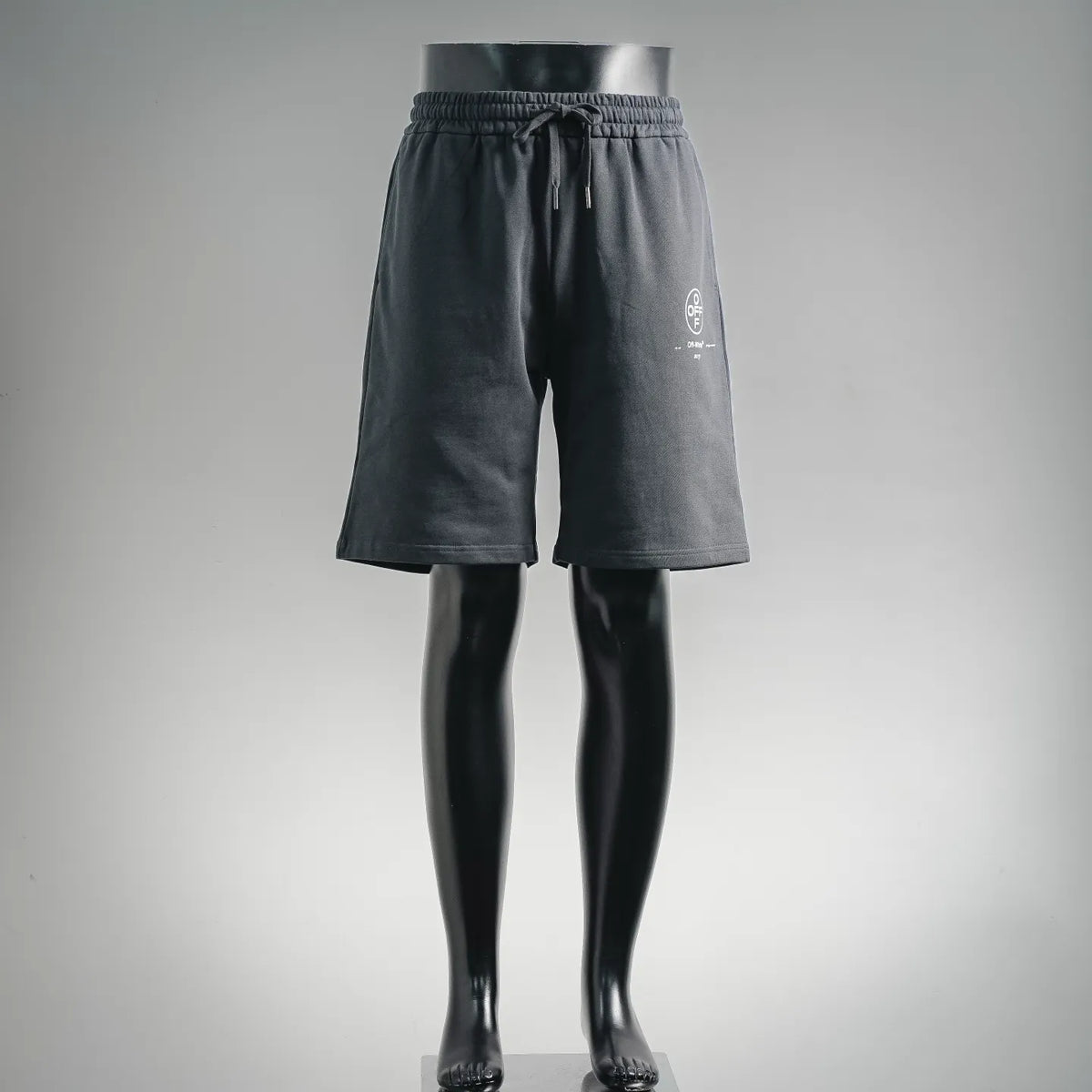 Off-White dark shorts with elastic drawstring waist and small front pocket
