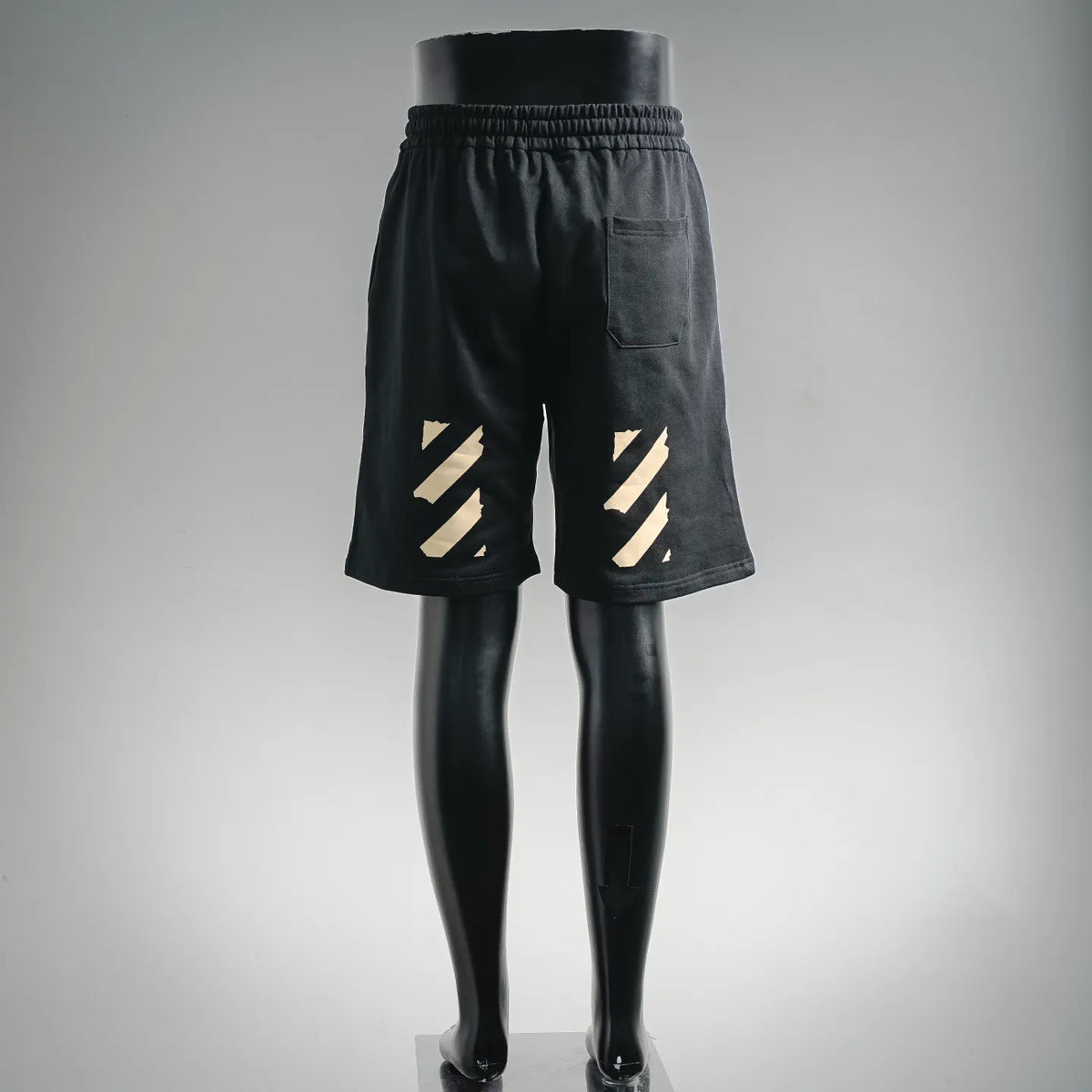 Dark drawstring shorts with elastic waist and large graphic on back
