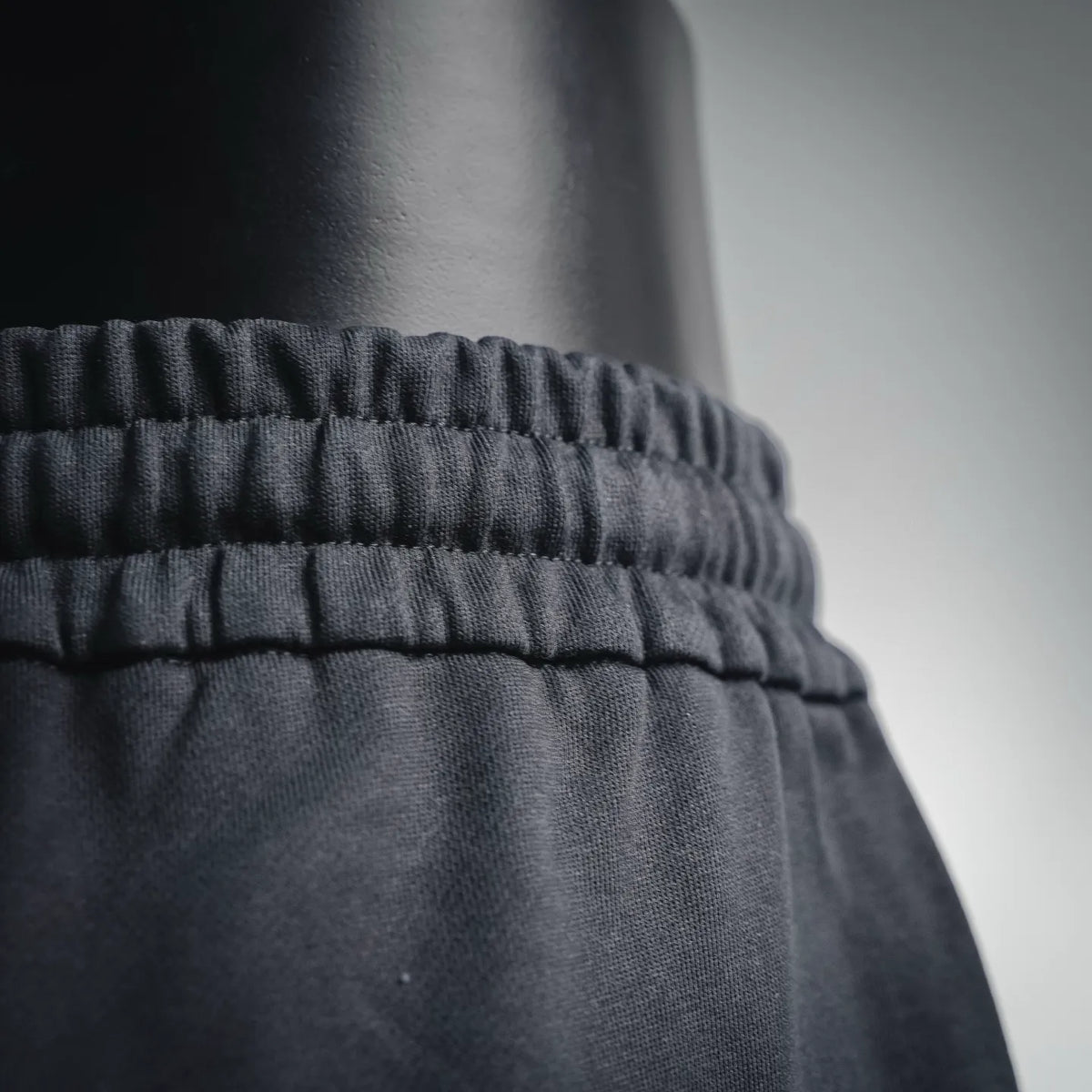 Dark elastic waistband detail on shorts