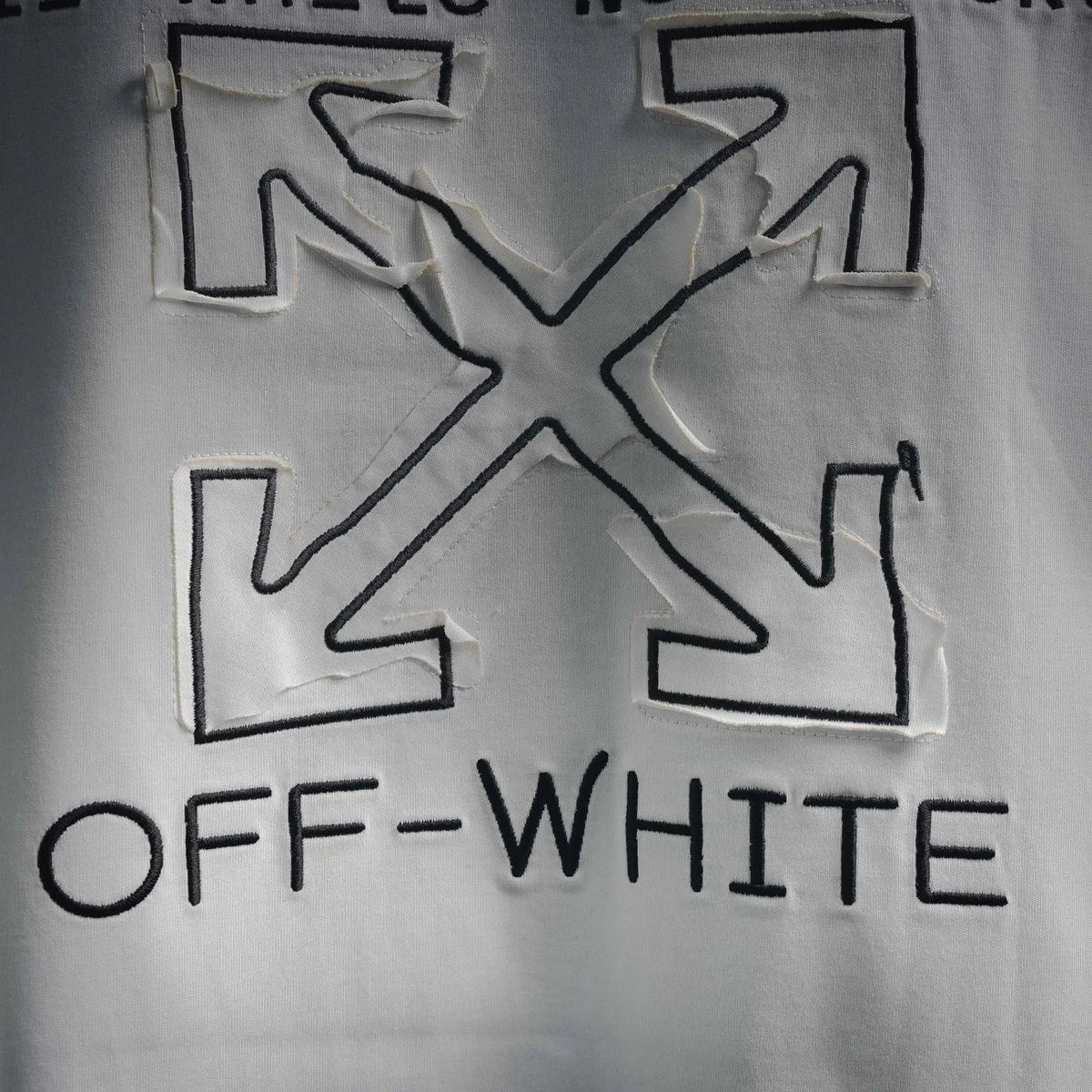 Off-White front graphic logo print on off-white short-sleeve T-shirt