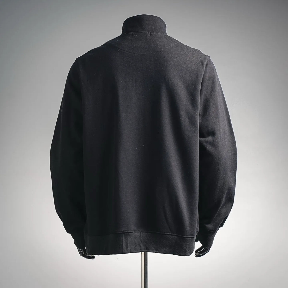 Black zip-up sweatshirt, back view with stand collar and ribbed hem