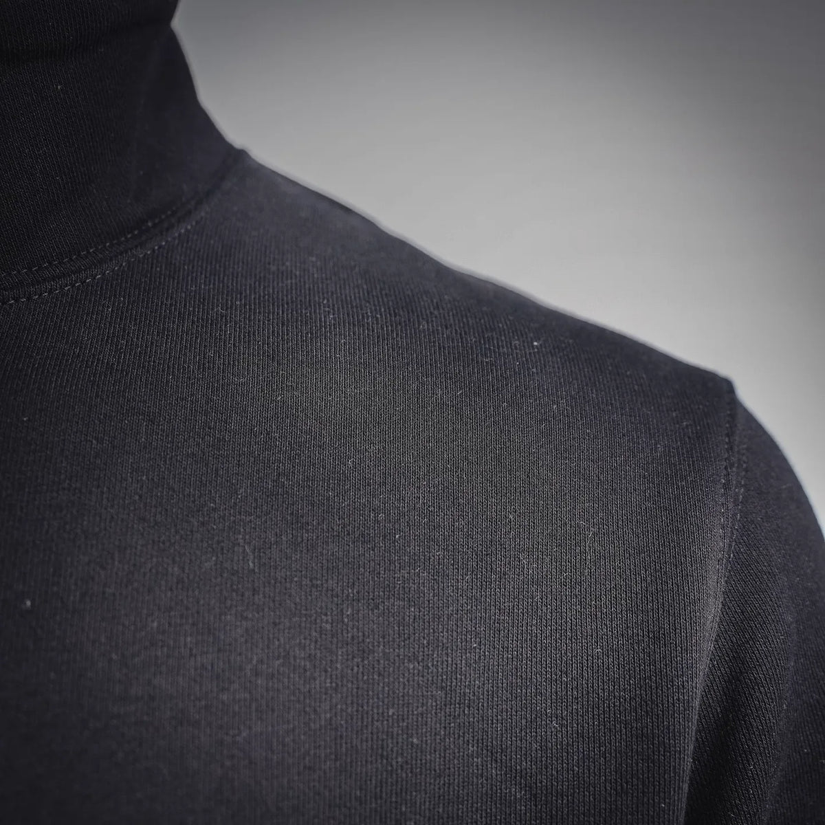 Black knit stand collar sweatshirt with textured fabric surface
