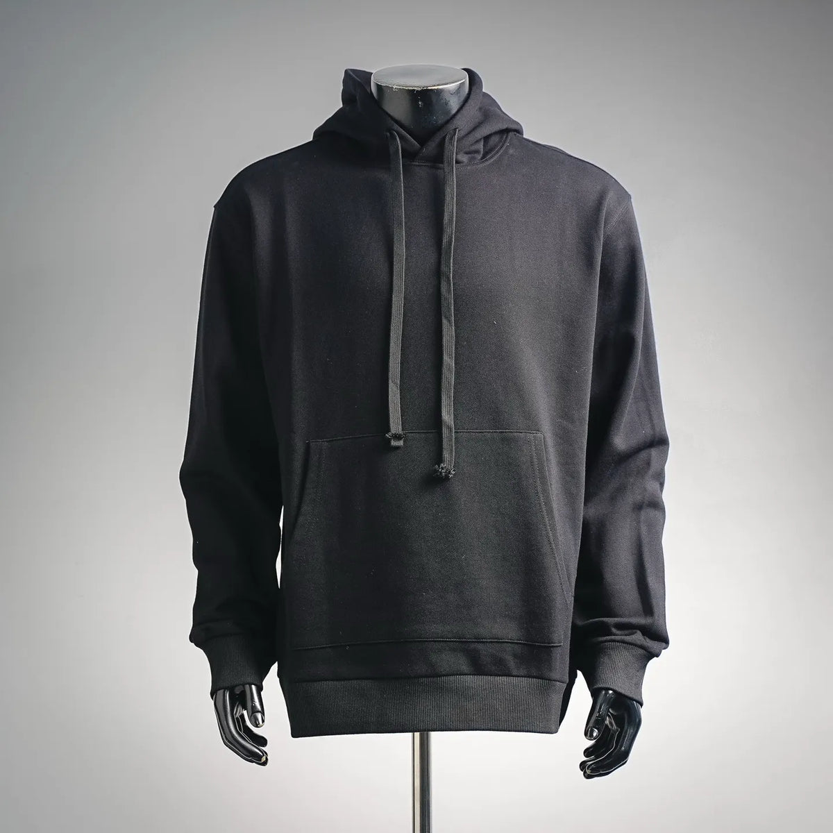 Black pullover long hoodie with drawstring hood and front kangaroo pocket