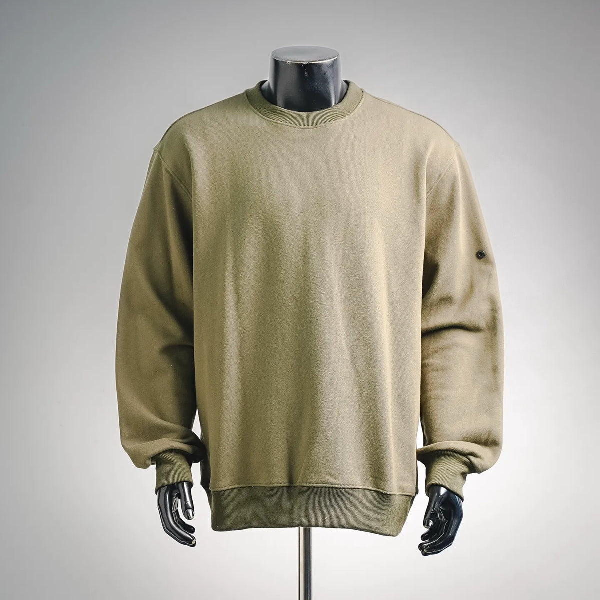 Olive green crewneck sweatshirt with ribbed collar and cuffs