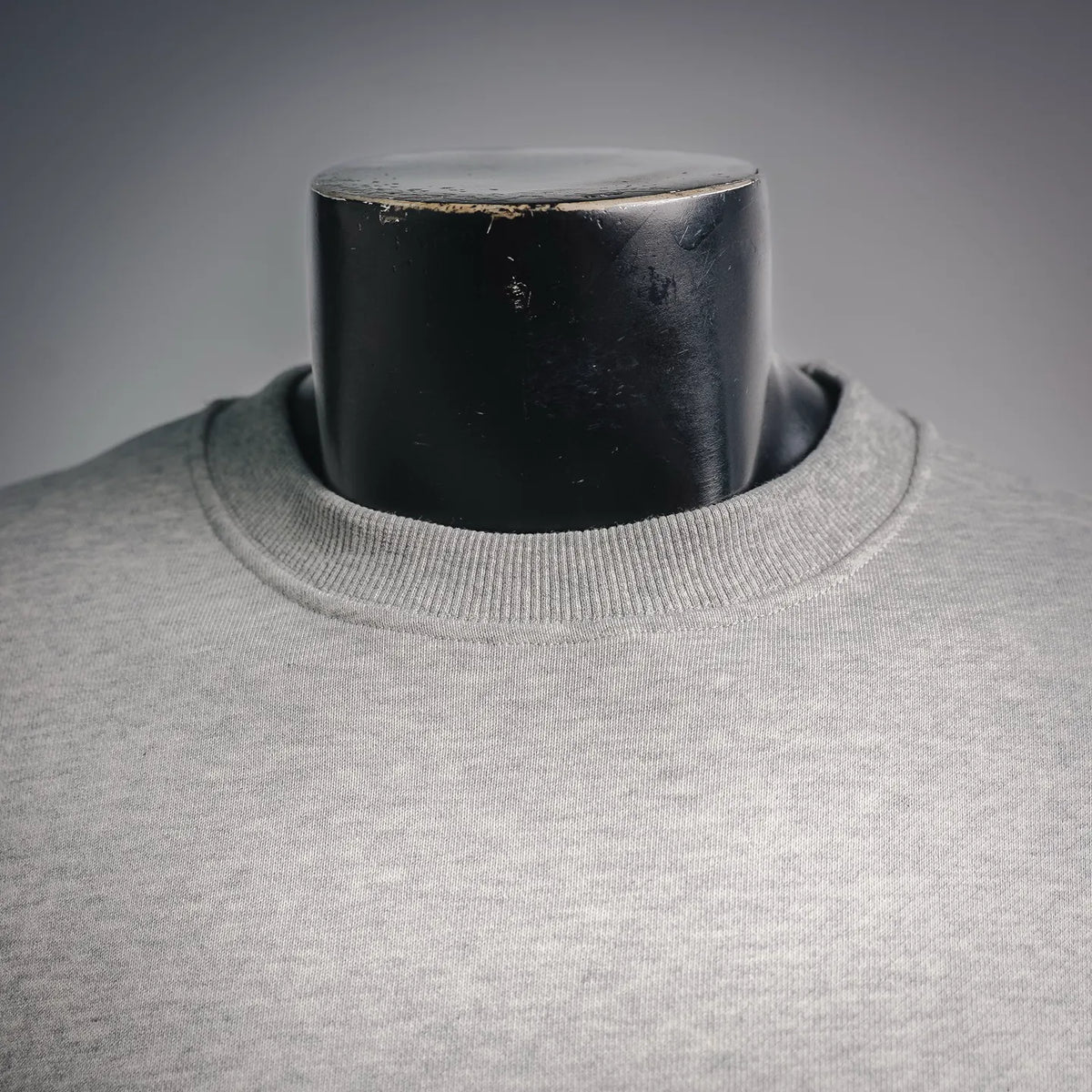 Light gray crewneck sweatshirt neckline with ribbed knit collar