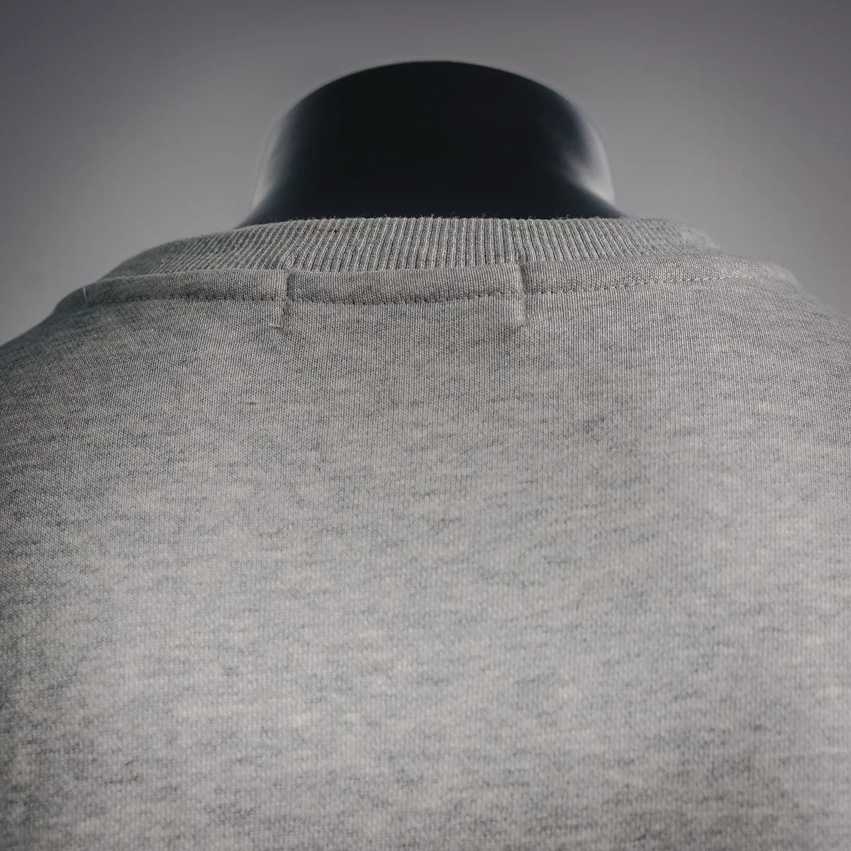 Light gray crewneck sweatshirt, back neckline with ribbed collar