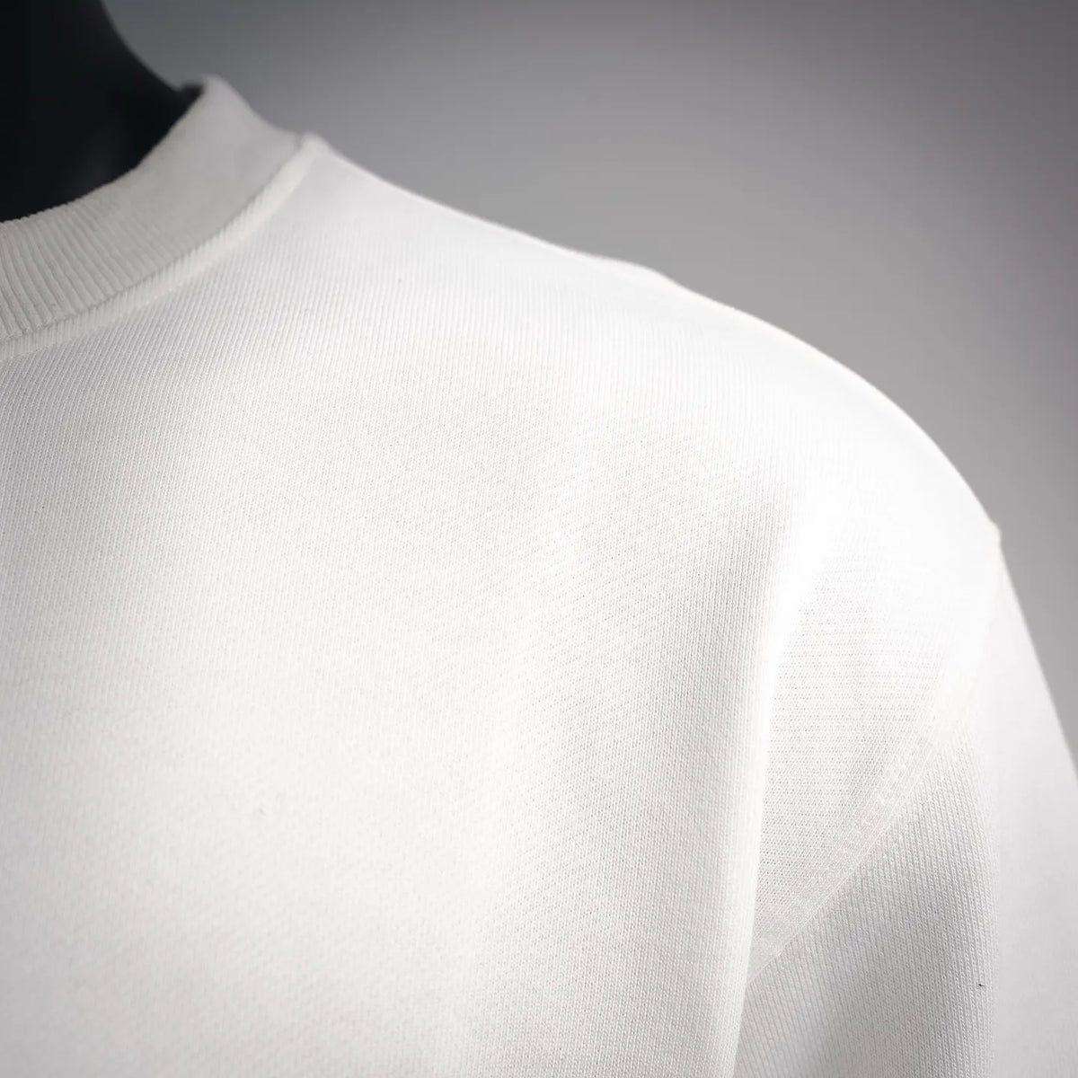 White Stone Island crewneck sweatshirt neckline close-up, ribbed collar detail