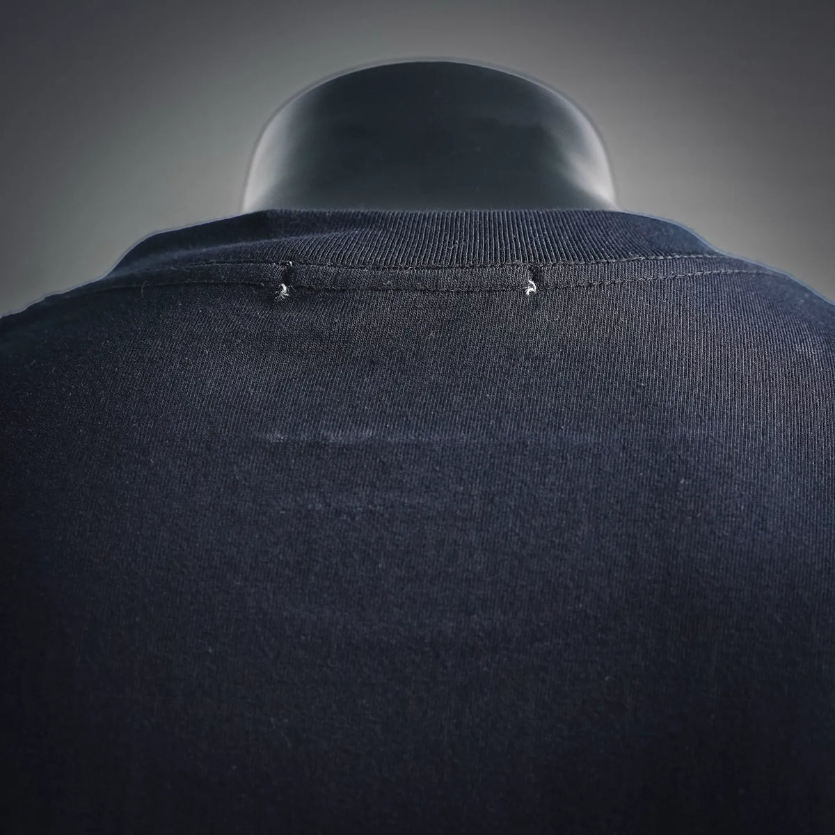 Navy crewneck sweatshirt collar seam close-up