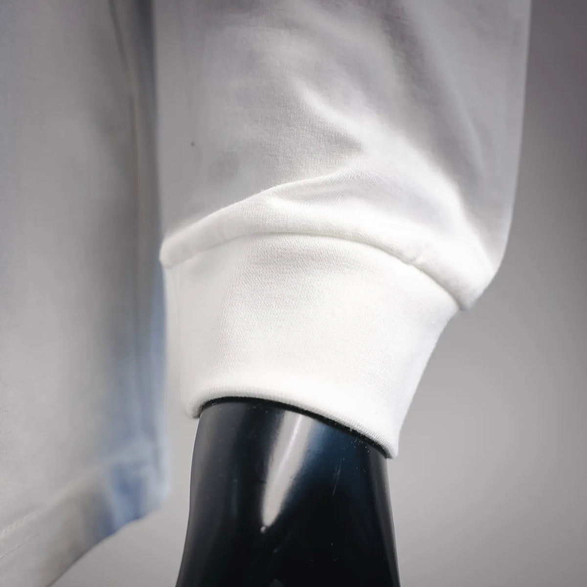 White long-sleeve T-shirt cuff with ribbed hem