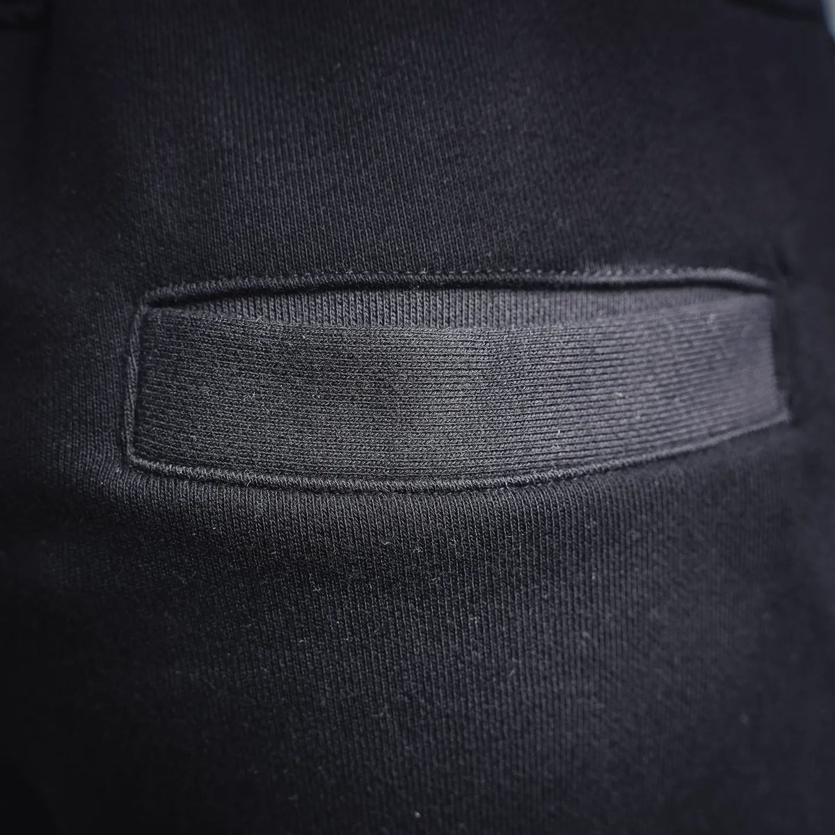 Stone Island black pants front panel with stitched pocket opening