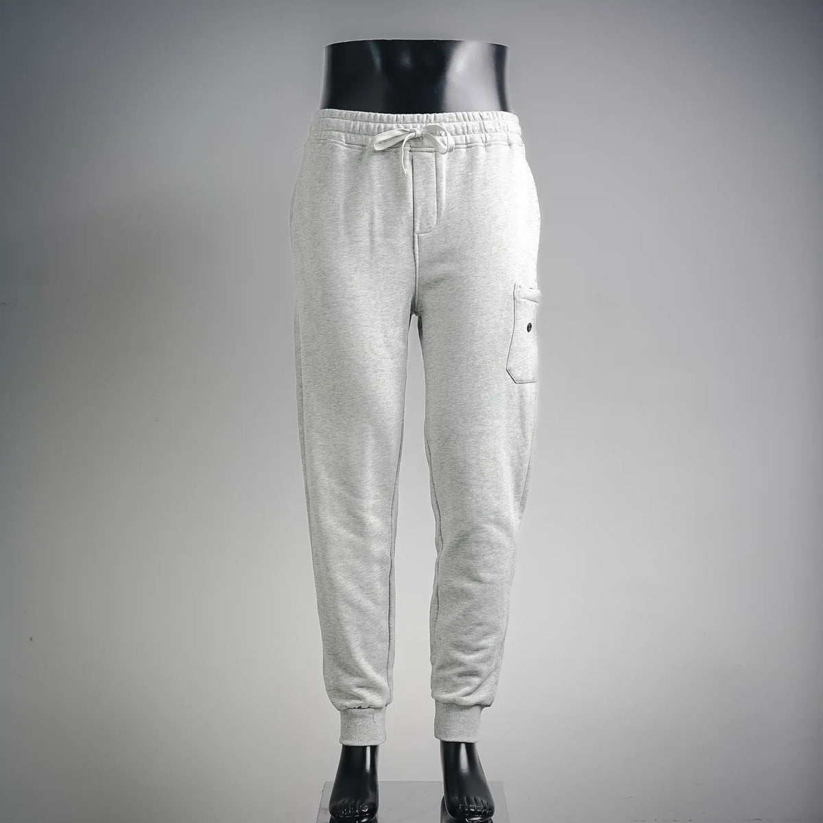 Light gray sweatpants with elastic waistband and drawstring, side pockets.